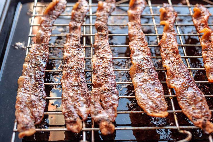 Prepped Bacon is placed in the oven.